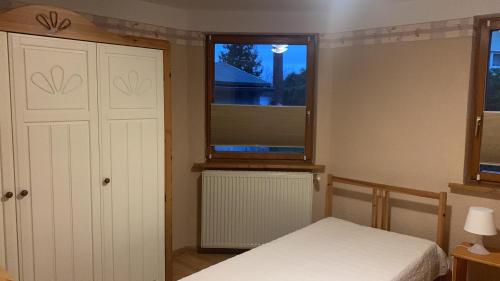 Postel nebo postele na pokoji v ubytování Ferienhaus Pauline am See