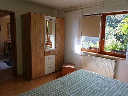 Postel nebo postele na pokoji v ubytování Ferienhaus Pauline am See