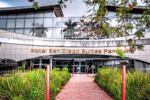 a building with a sign that reads hotel san diego suites portico at Flat com Varanda-Pampulha in Belo Horizonte