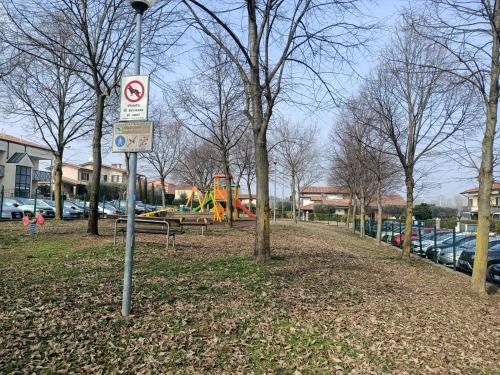 a no parking sign on a pole in a park at Luna in Cavalcaselle