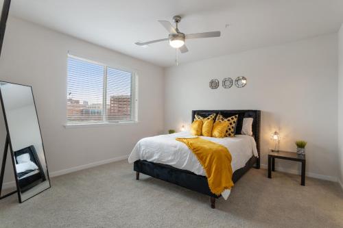 a bedroom with a bed and a ceiling fan at Modern Home 2BR 2BA Free Off-Street Parking & Wifi in Baltimore