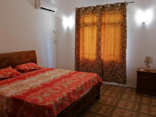 Ένα ή περισσότερα κρεβάτια σε δωμάτιο στο Khushi's Guest House - Cascavelle