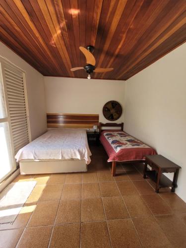 Säng eller sängar i ett rum på Casa Campo Águas de São Pedro