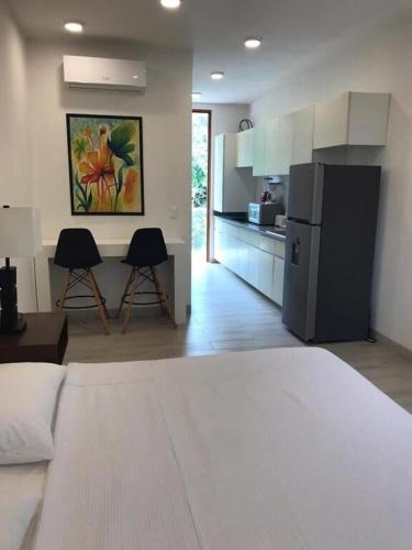 Η κουζίνα ή μικρή κουζίνα στο Estudio en Puerto Aventuras, Condominio con Alberca # 202