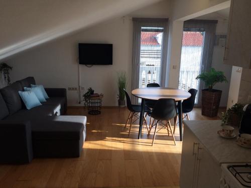 a living room with a couch and a table at Apartments Vahovec Vodice in Vodice