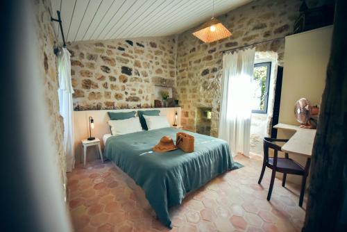 Tempat tidur dalam kamar di Le Domaine du Fayet