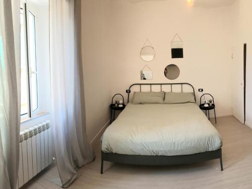 Een bed of bedden in een kamer bij La Casa del Grillo