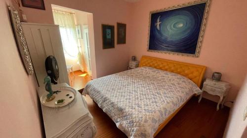 Katil atau katil-katil dalam bilik di Appartamento indipendente vista unica