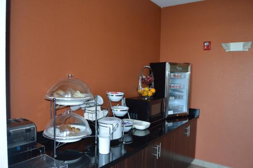a kitchen with a counter with food on it at Sleep Inn & Suites Elk City in Elk City