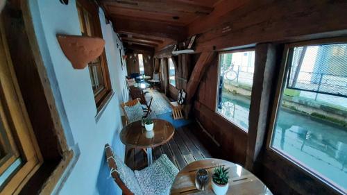 an overhead view of a dining room with tables and windows at Schiefes Haus in Ulm
