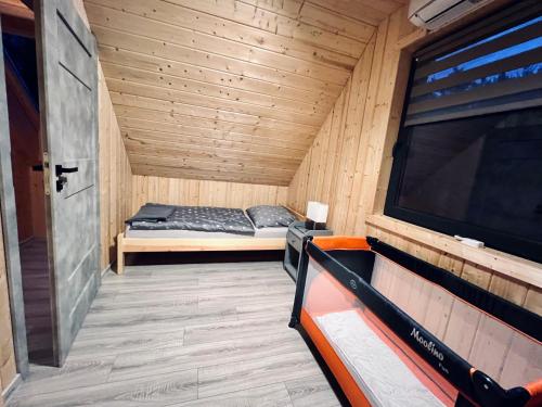 Postel nebo postele na pokoji v ubytování Domki w Borach