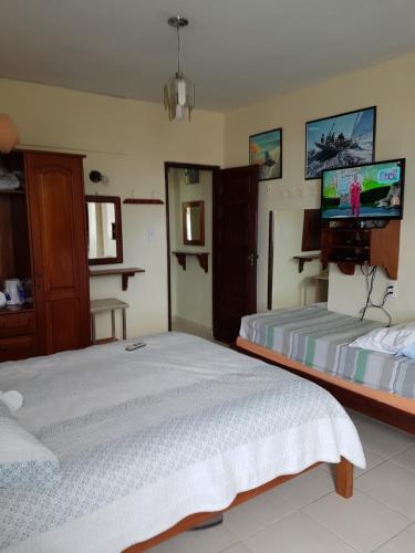 Ένα ή περισσότερα κρεβάτια σε δωμάτιο στο Apartamento no Maçarico, de frente para a praia