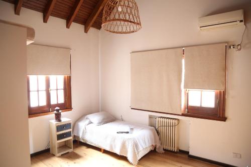 Tempat tidur dalam kamar di Casa en Córdoba