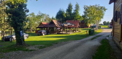 a house with a car parked in front of it at Zajazd na Podzamczu in Pieskowa Skała