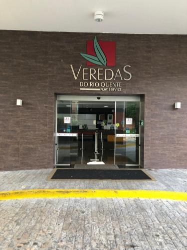a verda do not drink sign on the side of a building at Veredas do Rio Quente Flat 109 in Rio Quente