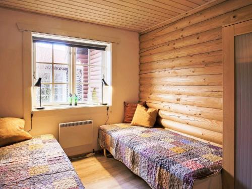 a bedroom with two beds and a window at 10 person holiday home in Væggerløse-By Traum in Marielyst