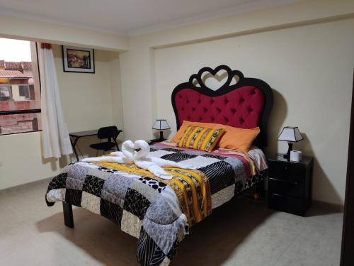 Ein Bett oder Betten in einem Zimmer der Unterkunft INTI SUMAQ WASI