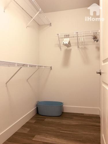 a room with two shelves on the wall and a blue bucket at Perfect Apt near UCLA w Parking Gym Pool WIFI in Westwood B3 in Los Angeles