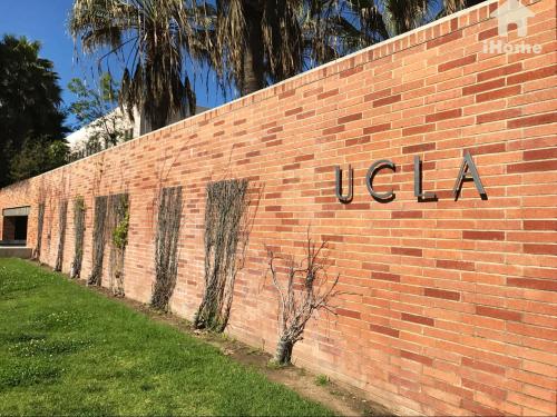 a brick wall with the word usa on it at Perfect Apt near UCLA w Parking Gym Pool WIFI in Westwood B3 in Los Angeles