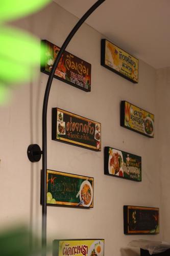 a wall with a bunch of signs on it at Yangshuo Lisa Boutique Hotel in Yangshuo