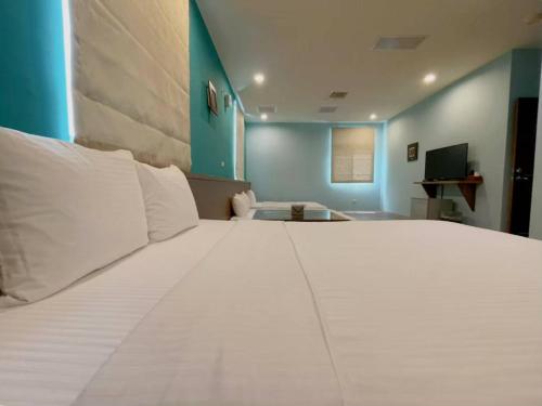 Säng eller sängar i ett rum på Coast Shan Shui B&B