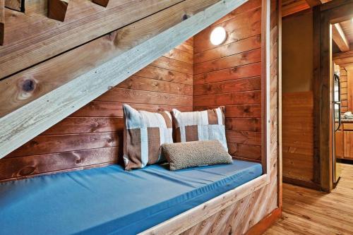 a bench in a room with wooden walls at Mama Bear's Retreat in Sevierville