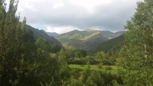 a view of a valley with mountains and trees at Turismo Rural Castell in Neril