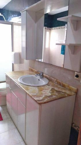 a bathroom with a sink and a counter top at Danadri Houses, Like At Home in Riobamba