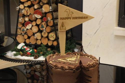 a chocolate cake with a happy birthday sign on top of it at Casa di Pino EcoLodge Hotel in Žabljak