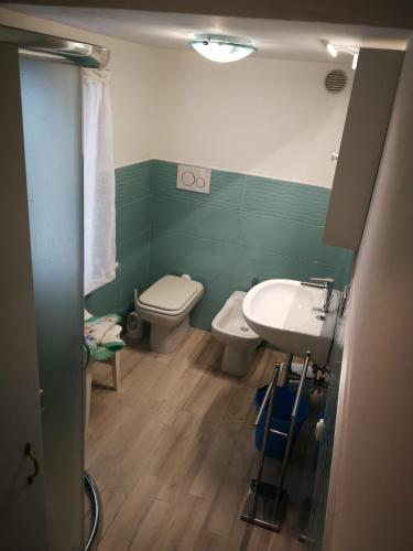a bathroom with a toilet and a sink at La Terrazza Del Conero monolocale in Sirolo