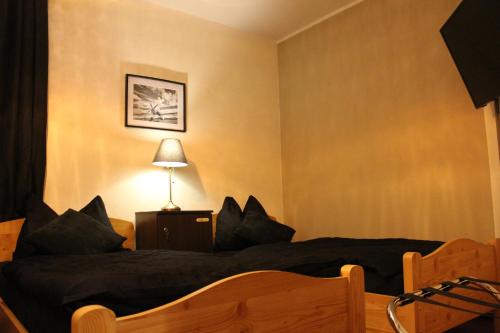 Ένα ή περισσότερα κρεβάτια σε δωμάτιο στο Stadthotel