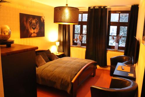 Postel nebo postele na pokoji v ubytování Stadthotel