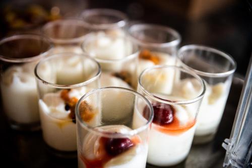 a group of glasses filled with different types of desserts at Baan Chaweng Beach Resort & Spa - SHA Extra Plus in Chaweng