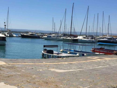 a group of boats are docked in a harbor at Casa Clio in Syracuse