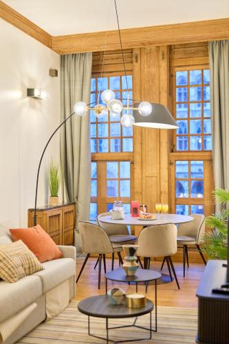 a living room with a couch and a table at Maison Grand Place Studio 1 in Brussels