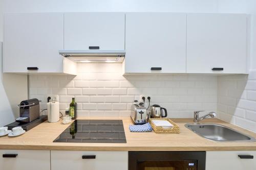 a kitchen with a sink and a counter top at Maison Grand Place Studio 1 in Brussels