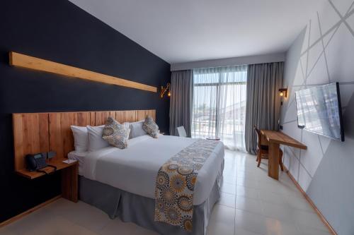 Giraffe Beach Hotelにあるベッド