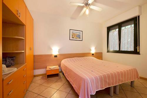 Säng eller sängar i ett rum på Villaggio Ducale