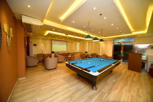 a billiard room with a pool table in it at Emirates Stars Hotel Apartments Dubai in Dubai