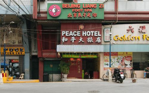 a building with a sign that reads peace hotel at Peace Hotel by RedDoorz in Manila