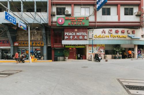 an empty street in front of a building at Peace Hotel by RedDoorz in Manila