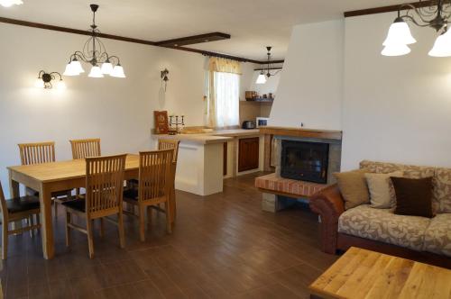 a living room with a table and a couch at Villa Bignonia in Varna City