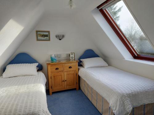 En eller flere senger på et rom på Chapelhill Croft