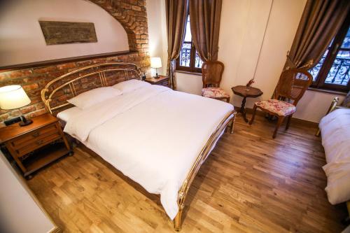 Ένα ή περισσότερα κρεβάτια σε δωμάτιο στο Vila Sonnet