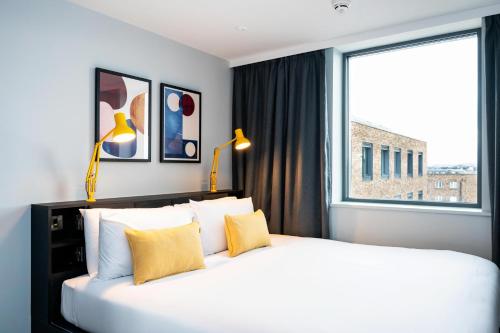 Ліжко або ліжка в номері Staycity Aparthotels Dublin Tivoli