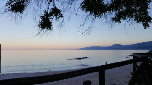 a view of the ocean from the beach at Appartamenti Jlune in Cala Gonone