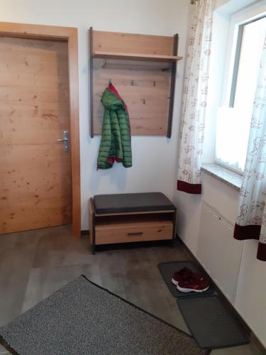 a room with a door and a bench and a window at Ferienhaus Weitblick in Flachau