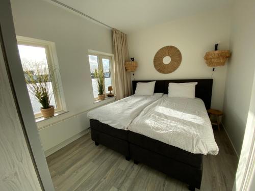 En eller flere senge i et værelse på Eb en Vloed Katwijk
