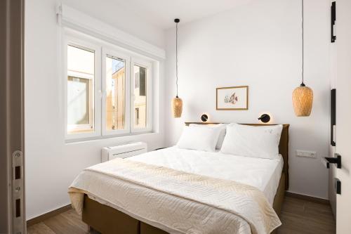 Postel nebo postele na pokoji v ubytování Leonidas - Annunziata Luxury Penthouse