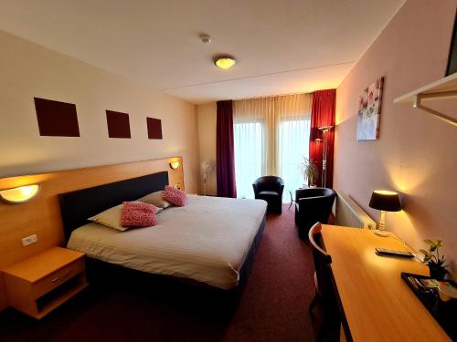 Hotel Restaurant 't Trefpuntにあるベッド